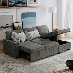 a living room filled with furniture and pictures on the wall above it's couch