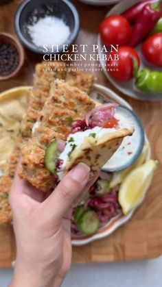 Iram Mansoor on Instagram: "Sheet Pan Chicken Kebab with Onion, Tomato, Pomegranate Salad and Garlic Yogurt Sauce

Minced Chicken Kebab:

Ingredients:

- 2 lbs boneless, skinless chicken thighs, minced
- 1 large red onion, finely chopped and squeezed
- 1-2 jalapeños, finely chopped
- 8-9 cloves fresh garlic, minced
- 1 tbsp freshly minced parsley
- Salt, to taste
- 1 tsp black pepper
- 1 tbsp garlic powder
- 1 tbsp onion powder
- 1 tsp ground cumin
- 1 tsp red chili flakes
- 3 tbsp oil

For the Onion, Tomato, Pomegranate Salad:

Ingredients:

- 1 cucumber, sliced
- 1 red onion, sliced
- 1 large tomato, seeded and finely chopped
- 1/2 cup pomegranate seeds
- 1 tbsp freshly chopped parsley
- Salt, to taste
- 1 tsp sumac
- 1 tsp lemon juice
- 2 tbsp olive oil

For the Garlic Yogurt Sauce:

In Minced Chicken Kebab Recipe, Garlic Yogurt Sauce, Chicken Starter Recipes, Garlic Yogurt, Chicken Kebab Recipe, Minced Chicken, Chicken Kebab, Sheet Pan Chicken, Pomegranate Salad