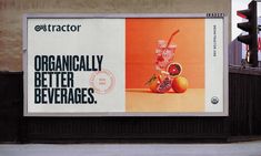 a large billboard on the side of a building advertising organicly better beverages and pomegranates