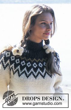 a woman wearing a black and white sweater