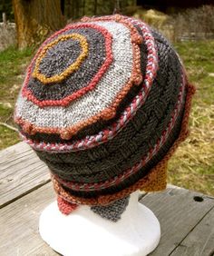 a knitted hat sitting on top of a white mannequin head