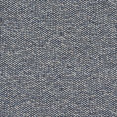 an upholstered blue and white fabric textured with small dots on the surface