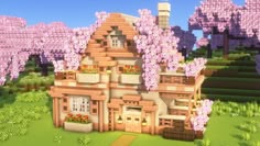 an image of a house in the middle of some bushes and trees with purple flowers on them