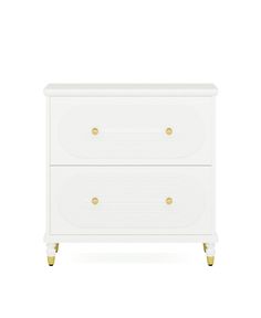 a white dresser with two drawers and gold knobs on the bottom, against a white background