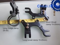 three different types of clamps are shown on a white surface with a measuring tape