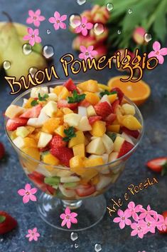 a fruit salad in a glass bowl with the words boni pomerbijo above it