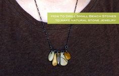 a woman wearing a brown shirt and black necklace with three small shells hanging from it