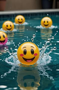 several balls with faces are in the water