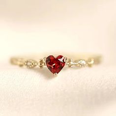 The Birthstone SeriesJANUARY GARNET BIRTHSTONE RING A gift with a meaning. Get yourself or your loved ones this magnificent heart-shaped garnet ring surrounded by a dazzling gold band and eliminate negative feelings but instead instill greater self-confidence and mental clarity to promote creative thinking and peace of mind. Our gorgeous variety of birthstone rings include never-before-seen designs and exclusive collections that aren't found elsewhere, making each piece a treasure to own and che Garnet Birthstone, Negative Feelings, Birthstone Rings, Garnet Ring, Garnet Rings, Mental Clarity, Creative Thinking, Holiday Sales, Live In The Now