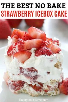 there is a piece of cake with strawberries on the top and white frosting