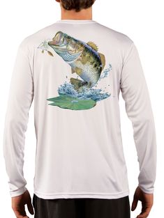 a man wearing a white long sleeve shirt with a fish on it's chest