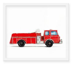 a red fire truck is shown in this white frame