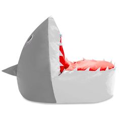 an inflatable shark bed with red and white stripes on it's mouth