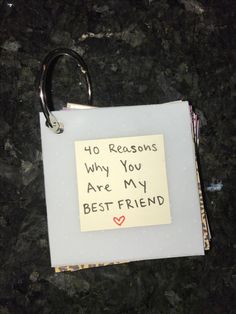 a note attached to a pair of scissors on top of a piece of paper with the words, 40 reasons why you are my best friend