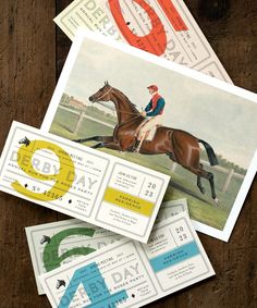 three horse racing tickets sitting on top of each other next to an envelope with the number six