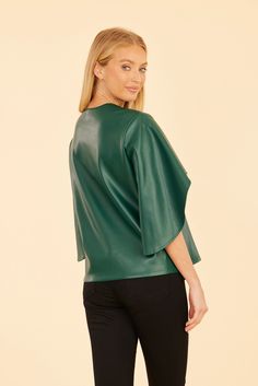 Our Faux Leather Cascade Sleeve Top is sure to be a striking addition to your autumn wardrobe. This versatile and stylish blouse features dramatic cascade sleeves that flow beautifully, adding movement and flair to your look. The sleek faux leather finish offers a modern edge, making it the perfect piece to complete your chic seasonal outfits. Faux leather Cascading sleeves V-neck Available in Black, Dark Pink, and Green Dry clean Style: 75634 Seasonal Outfits, Fur Top, Linen Gauze, Autumn Wardrobe, Iconic Dresses, Leather Finish, Stylish Blouse, Wrap Cardigan, Jacket Sale