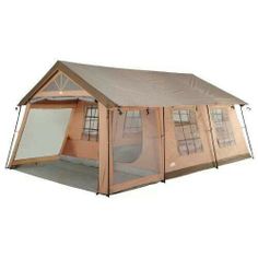 a tent that is set up on the ground with its door open and windows closed