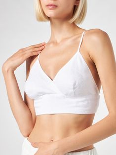 White linen bralette topElastic backRegular fitCoordinating itemComposition: 100% linen Elegant Summer Tops With Removable Bra Pads, Chic Summer Camisole With Removable Bra Pads, Chic Spring Top With Removable Bra Pads, Elegant Summer Crop Top With Removable Bra Pads, Chic Cropped Top With Removable Bra Pads, Fitted Linen Crop Top, Chic Linen Crop Top, Summer V-neck Top With Removable Bra Pads, Chic Linen Spaghetti Strap Tops