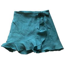 Lulus Sweet Desires Teal Ruffled Wrap Mini Skirt. Ruffled Mini Hem. Hidden Internal Button And Internal Tie. Lightweight Woven Fabric. New With Tags! Blue Bohemian Flowy Wrap Skirt, Blue Tiered Lined Wrap Skirt, Blue Casual Ruffled Mini Skirt, Blue Flowy Mini Skirt With Ruffles, Teal Cotton Skirt, Tropical Print Skirt, Turquoise Skirt, Lulu Skirt, Teal Skirt