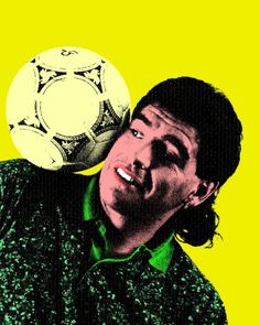 a man holding a soccer ball up to his face while wearing a green and white shirt