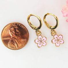 ♥ Gold Cherry Blossom Earrings Peach Plum Charm Flower Gift Japanese Cherry Blossom Jewelry Gift for Women Personalized Gift ♥ This is Beautiful Gold Cherry Blossom Earrings Charm on ear hook ♥ Alloy charm Flower Gold Plated Pink Enamel Lead & Nicker Safe Approx : 12mmx9mm x2mm **Conversion: 1 inch=25.4 mm or 1 mm=0.0393 inches** ♥ Real 18K Gold over ear hook 14.5x12 mm ♥ We strive for next day shipping, but we do not ship on Saturdays, Sundays, and Holidays. It may sometimes take a bit long Delicate Pink Flower Earrings For Spring, Dainty Pink Flower Earrings For Spring, Rose Gold Flower Earrings For Spring, Spring Rose Gold Earrings For Gift, Rose Gold Earrings As Spring Gift, Rose Gold Earrings For Spring Gift, Cute Gold Flower Earrings For Spring, Pink Flower Shaped Jewelry For Spring, Pink Flower-shaped Jewelry For Spring