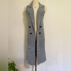 Made With Love Warm & Cozy Knit Collection. Women’s Sleeveless Long Vest. New With Tags Size: Medium Pit To Pit: 17" Length: 37" Super Fast Shipping!! From A Pet Free/ Smoke Free Environment! Please Message Me With Any Questions. Thanks For Looking God Bless. Knit Sweater Vest With Pockets For Winter, Gray Sleeveless Vest For Fall, Gray Sleeveless Vest Outerwear, Sleeveless Gray Outerwear For Work, Sleeveless Sweater Vest For Winter Layering, Chic Knit Vest For Winter, Chic Winter Knit Vest, Fitted Sweater Vest For Winter Layering, Cozy Sleeveless Sweater Vest For Fall