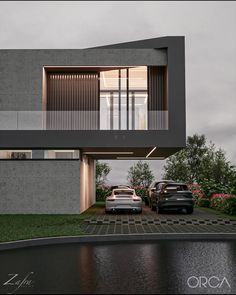 two cars parked in front of a modern house