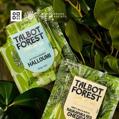 two packets of talbot forest on top of green leaves