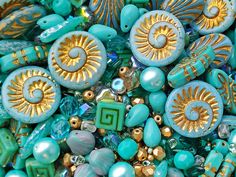 many different types of beads are arranged together