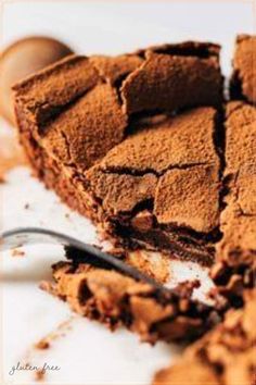 a piece of chocolate cake next to a spoon