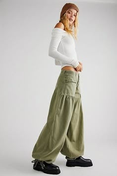 So cool balloon-style jeans from our We The Free collection featured in a mid-rise silhouette with dropped, front patch-style pockets and cinch-tie banded ankles with femme pleating throughout for added dimension. * Zip-fly and button closure * Soft, stretch denim * Belt loops at waist | We The Free Lotus Jeans at Free People in Green, Size: 26 Free People Aesthetic, Bohemian Pants, Patches Fashion, Denim Belt, Free People Style, All Jeans, Free People Clothing, Free People Jeans, Bottom Clothes