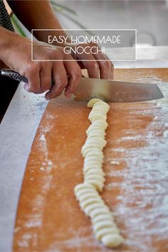 a person cutting up some food with a knife