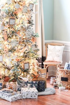 a christmas tree with presents under it