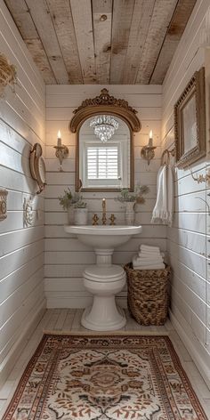 a bathroom with a sink, mirror and rug