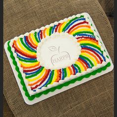 a square cake decorated with multicolored icing