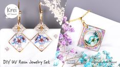 three pieces of jewelry sitting on top of a white table next to purple and blue flowers