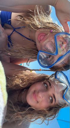 two women wearing goggles and swimming gear