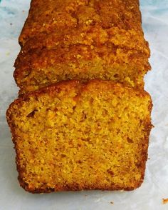 two pieces of bread sitting on top of paper