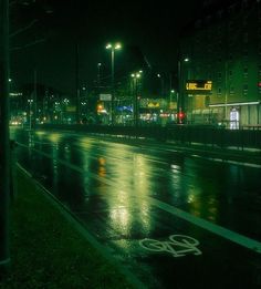 an empty street at night in the rain