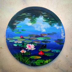 a painting of water lilies on a blue background