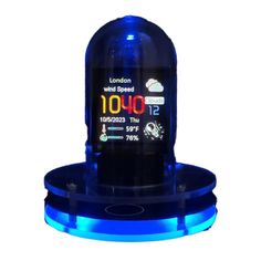 an electronic device with blue lights on it's display stand and clock displayed in front of a white background