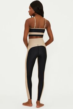 The Colorblocked Leggings is our high-waisted ribbed legging. This legging has the same rise as our best selling Piper and Ayla Legging. This ultra-soft black ribbed fabric features a tan panels along the side and on the inside. Pair it with our matching Eva Top to or our Leah top in tan or black to make it a workout set. Tasman Slippers Outfits, Slippers Outfit, Ugg Tasman Slippers, Hairstyles With Glasses, Gaucho Pants, European Summer Outfits, Color Block Leggings, Dress Halloween Costume, Ribbed Leggings