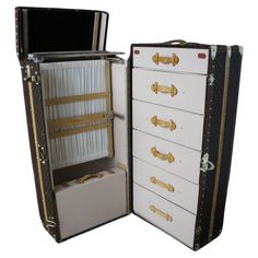 This impressive Louis Vuitton wardrobe features monogramm canvas, lozine trim, LV stamped solid brass locks and studs as well as solid brass corners. It has got a lift top that closes thanks to two Vuitton stamped brass locks. Its interior is remarkable with a folding hanging section and its original hangers on one side as well as a suitcase for shoes then on the other side, a series of seven drawers. Serial number label. It still has got its 2 original working keys. It would be perfect in a lob Wardrobe Trunk, Trunk Makeover, Trunks For Sale, Sac Louis Vuitton, Brass Corners, Louis Vuitton Trunk, Louis Vuitton Luggage, Whisky Bar, Travel Trunk