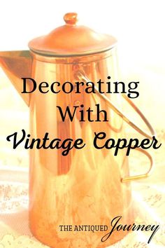 a copper coffee pot sitting on top of a lace covered table cloth with the words decorating with vintage copper