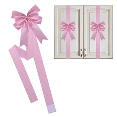 two pink bows are attached to the doors