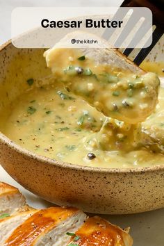 a wooden bowl filled with cheese and bread