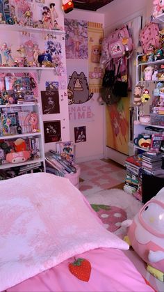 a bedroom with pink bedding and lots of toys