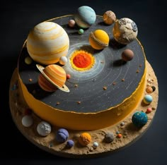 a cake decorated with the solar system and its planets