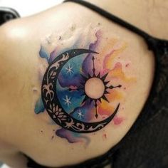 a woman with a tattoo on her stomach has the moon and stars painted on it