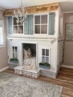 a doll house built into the side of a wall next to a rug and window